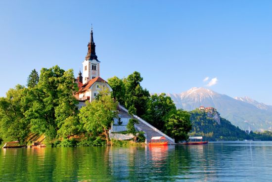 St Martin church on island and Bled lake landscape in Slovenia